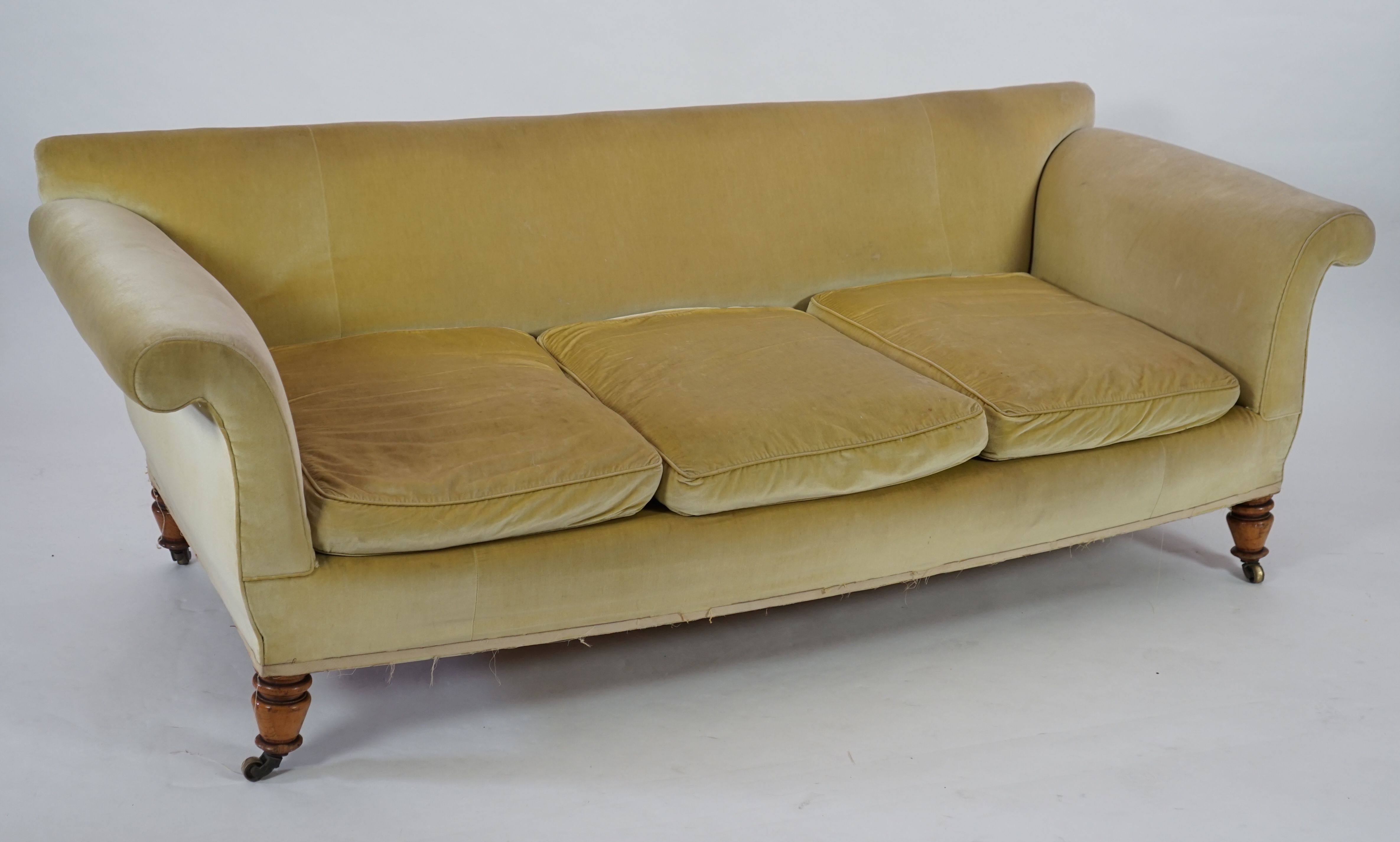 A large Victorian sofa, in the manner of Howard & Sons, probably Swietenia mahagoni with a Fagus sylvatica frame
